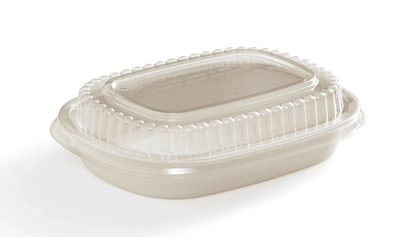 A person's hand removing a clear plastic lid from a bagasse bowl before placing it in the microwave